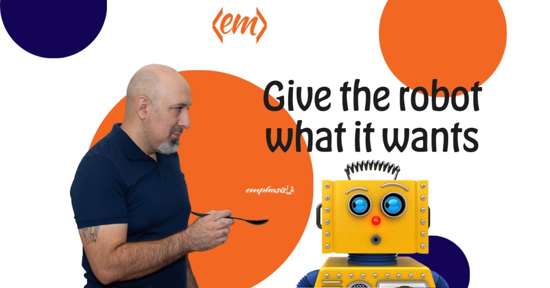 feeding a robot. Text in background: Give the robot what it wants